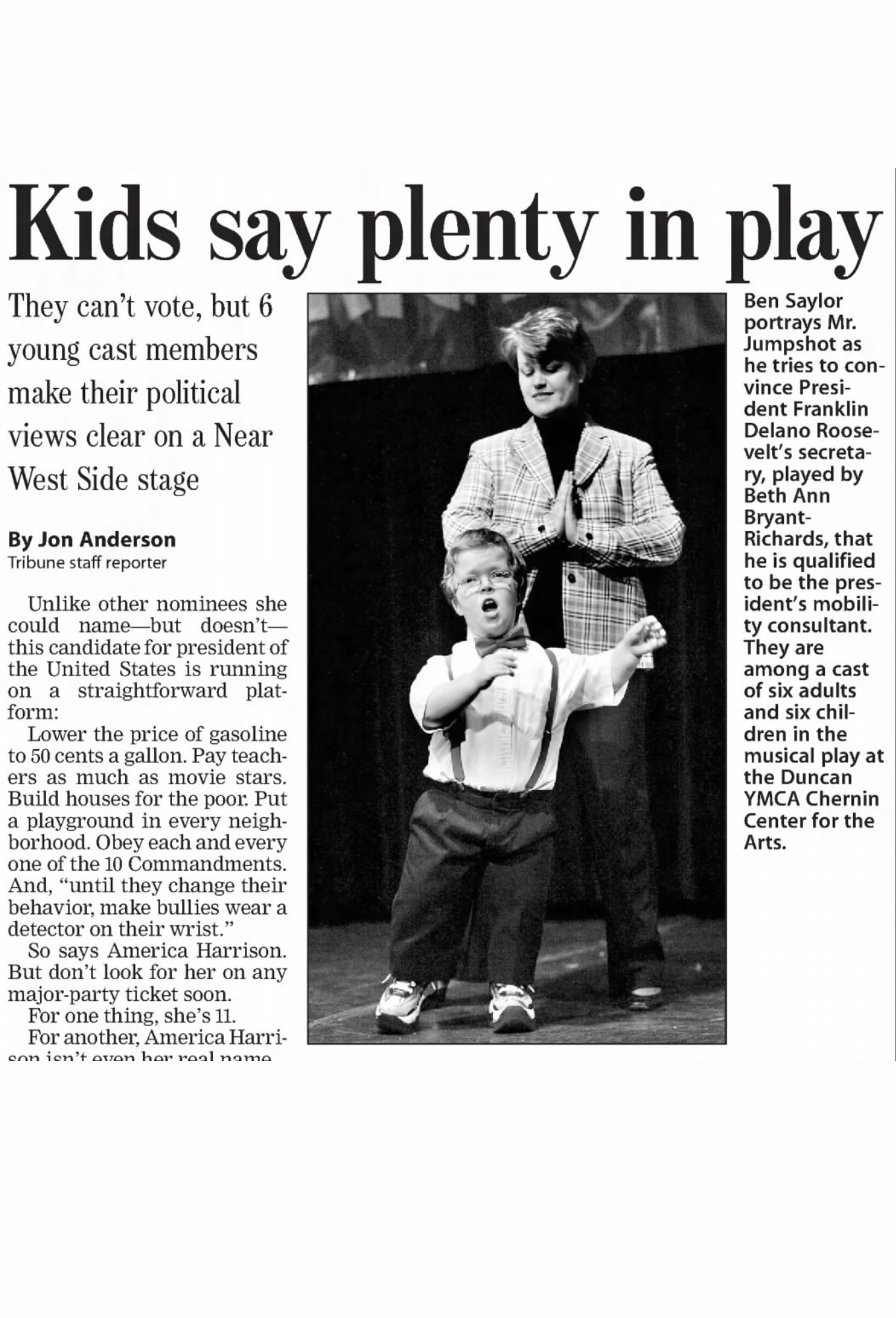 Cropped news article from the Chicago Tribune showing Ben Saylor and Beth Ann Bryant-Richards singing and dancing in a show with Tellin' Tales Theatre. Headline: "Kids say plenty in play."